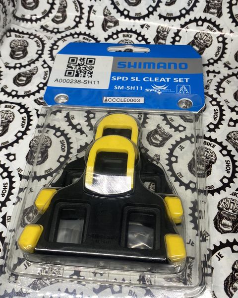 Shimano pedal cleats for road bikes, orange option.