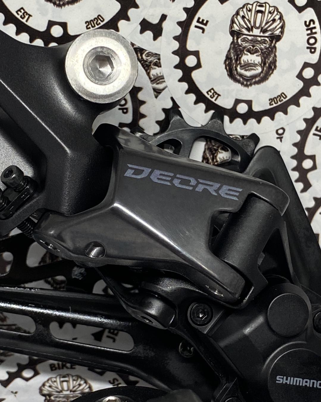 Shimano M6100 12-speed clutch rear derailleur and non-window shifter with cable included.