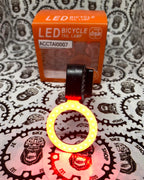 Rechargeable LED circular bike tail light for safety.