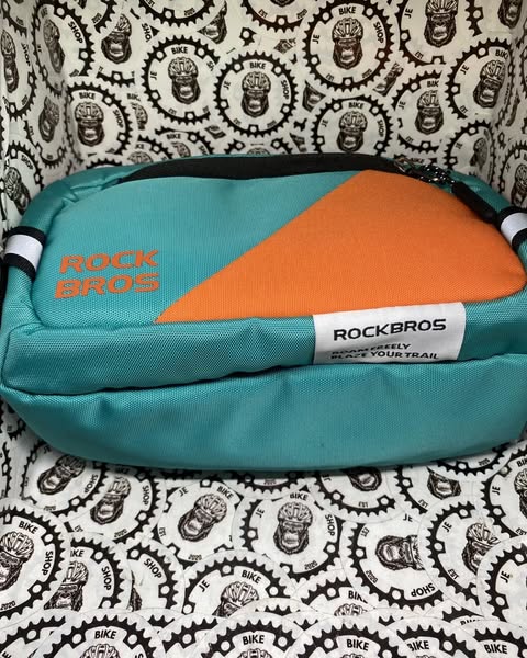 Portable RockBros handlebar bag for bikes with spacious storage and reflective design.