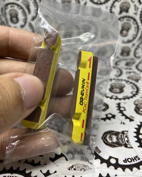 Lightweight OG Evkin carbon brake shoes, removable design.