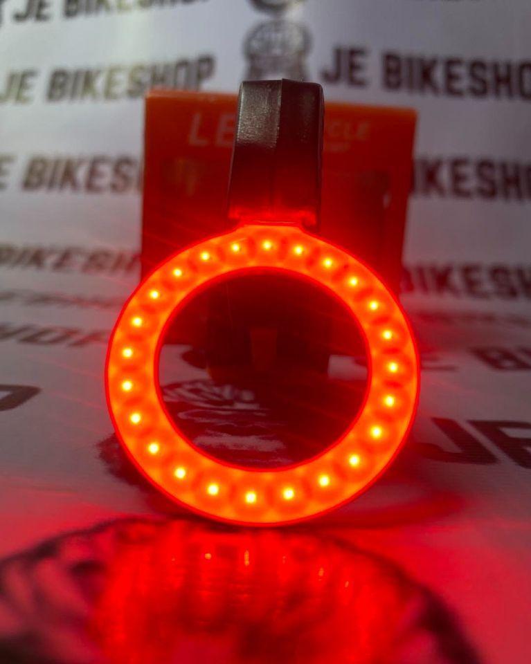 LED circular bicycle rear light for night riding.