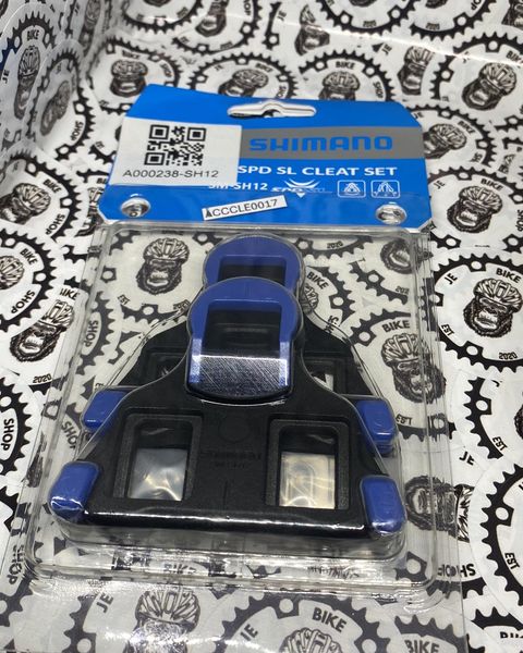 Road bike Shimano cleats attachment orange or “Bala” style.