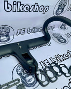 KOCEVLO integrated drop handlebar plain black, carbon fiber build.