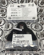 Orange Shimano road bike cleats for secure pedal connection.