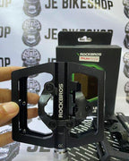 Lightweight ROCKBROS flat pedals with cleats for off-road cycling.