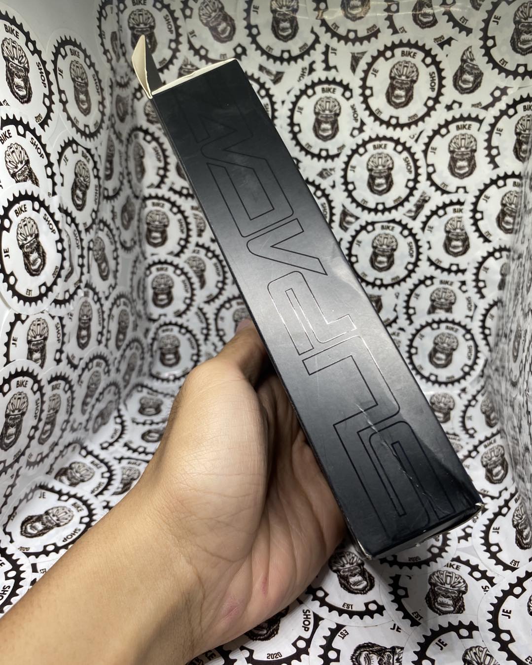 Non-slip Supacaz bar tape with aluminum finishing plugs