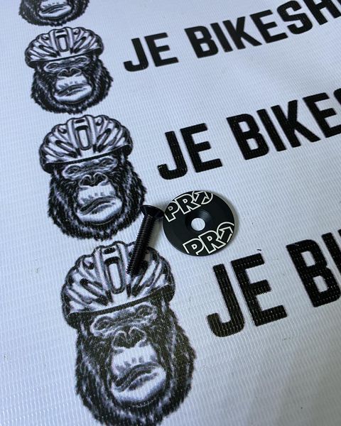 Carbon and Shimano Pro lightweight top cap with bolts for bicycles.