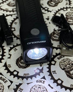 Bengguo front bike light with strap and USB charger.