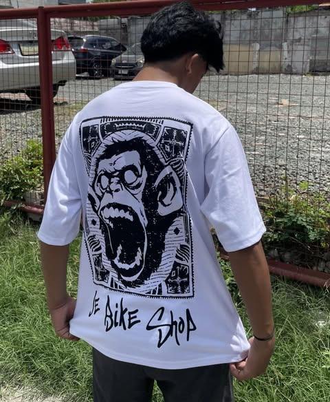 Large JE Bikeshop white tee for cycling fans.