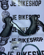 Shimano Claris R2000 8-speed STI shifter for road bikes.