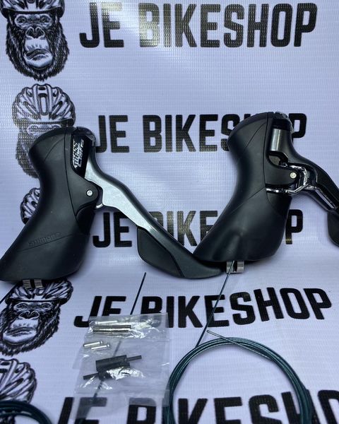 Shimano Claris R2000 8-speed STI shifter for road bikes.