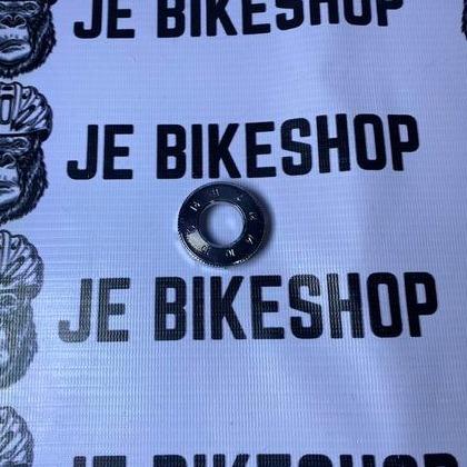 Spoke wrench tool for bicycle wheel adjustment.