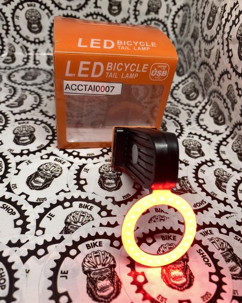 Bright LED circle tail light for rear bike visibility.