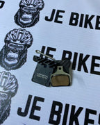 Durable JE Bike L03A metal brake pad with cooling fins.