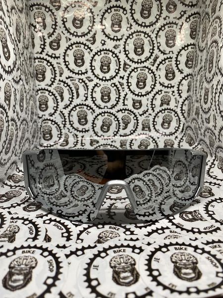 Silver cycling shades with UV protection for outdoor rides.