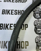 Black Compass 700x23C tire designed for smooth, efficient rides