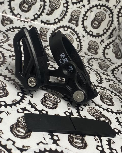 Durable frame-mounted adjustable chain guide for smooth shifting