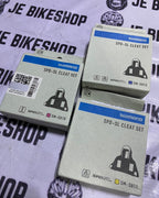 Shimano boxed road bike shifter attachments in red, blue, yellow.