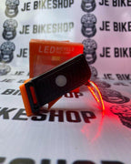 Waterproof LED circle tail light for cycling safety.